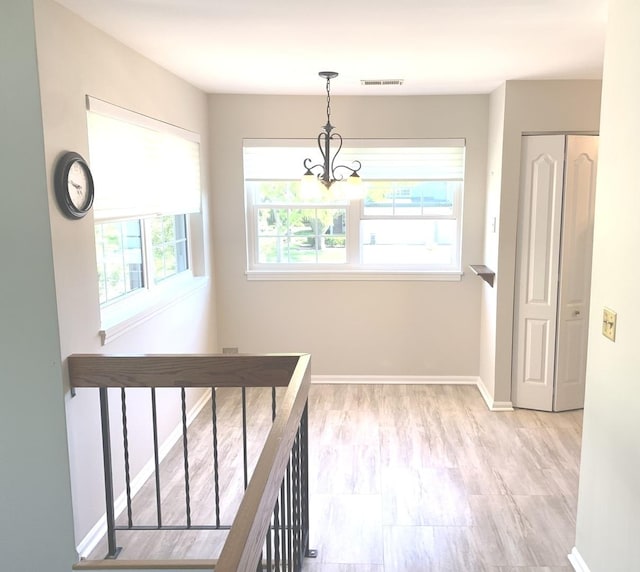 1422 W Orchard Pl Unit B, Arlington Heights, IL 60005 - corridor with a chandelier and baseboards