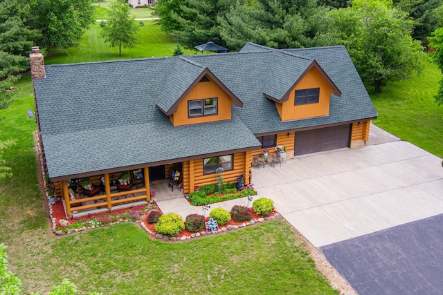 310 N Oak Ln, Dixon, IL 61021 - cabin with log siding, roof with shingles, a front lawn, and a chimney