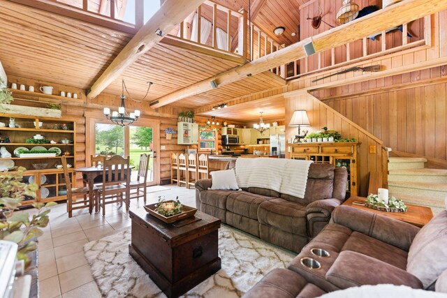 310 N Oak Ln, Dixon, IL 61021 - living area featuring a chandelier, wooden ceiling with exposed beams, tile patterned floors, stairway, and wood walls