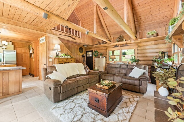 310 N Oak Ln, Dixon, IL 61021 - living room featuring wood ceiling with exposed beams, healthy amount of natural light, log walls, light tile patterned floors, and high vaulted ceiling