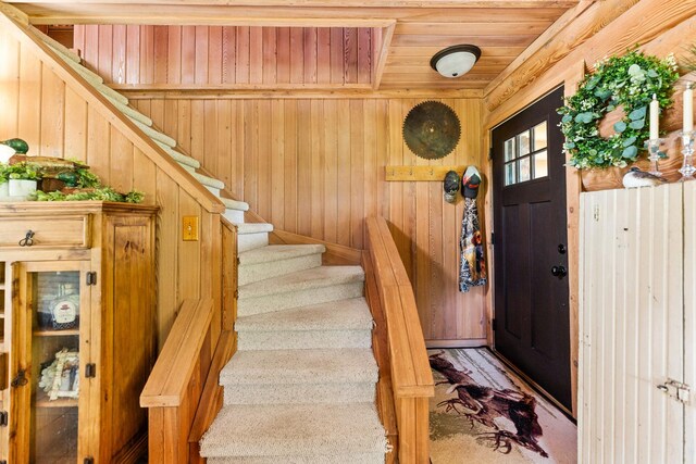 310 N Oak Ln, Dixon, IL 61021 - entrance foyer with wood ceiling, wooden walls, and stairs