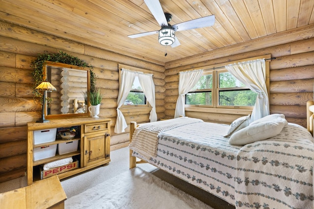 310 N Oak Ln, Dixon, IL 61021 - carpeted bedroom with wood ceiling and log walls