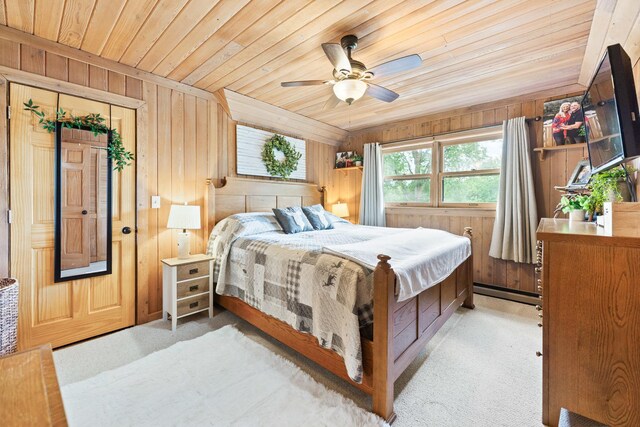310 N Oak Ln, Dixon, IL 61021 - bedroom with wood ceiling, wood walls, light colored carpet, a baseboard radiator, and ceiling fan