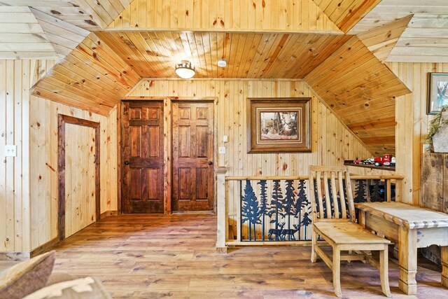 310 N Oak Ln, Dixon, IL 61021 - dining space featuring wooden walls, vaulted ceiling, wood ceiling, and hardwood / wood-style floors