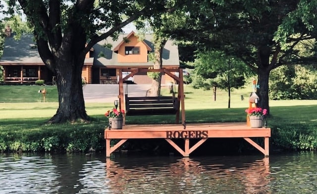 310 N Oak Ln, Dixon, IL 61021 - dock area featuring a yard and a water view