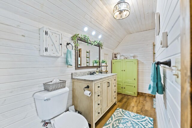 310 N Oak Ln, Dixon, IL 61021 - bathroom featuring vanity, lofted ceiling, wood walls, toilet, and wood ceiling