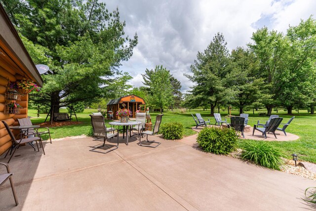310 N Oak Ln, Dixon, IL 61021 - view of patio featuring outdoor dining area and a gazebo