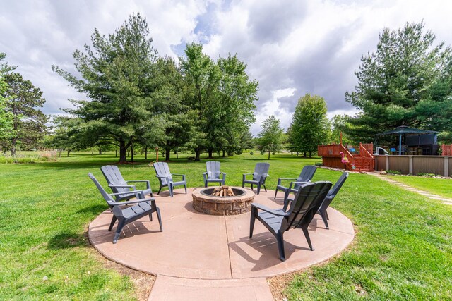 310 N Oak Ln, Dixon, IL 61021 - view of patio with an outdoor fire pit and a wooden deck
