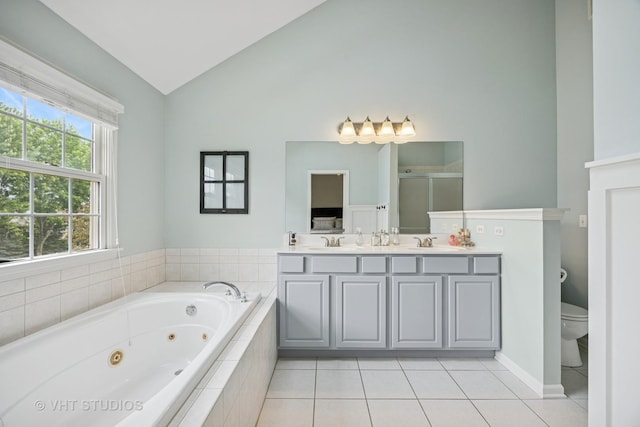 651 Clover Dr, Algonquin, IL 60102 - bathroom with lofted ceiling, double vanity, tile patterned floors, a jetted tub, and toilet