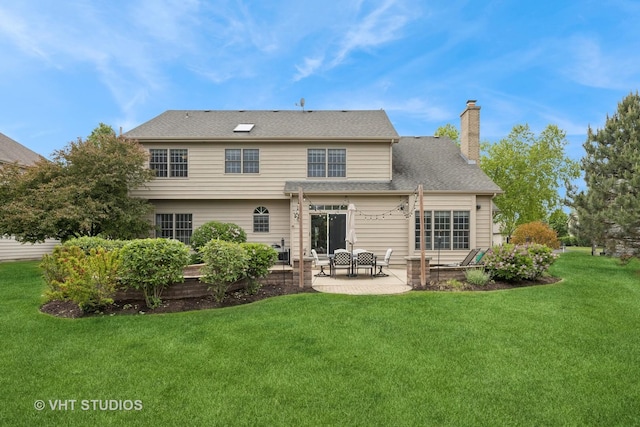 651 Clover Dr, Algonquin, IL 60102 - back of house with a patio, a chimney, and a yard