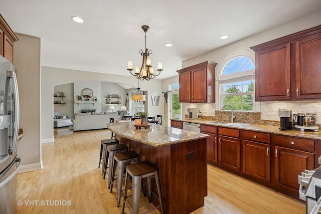651 Clover Dr, Algonquin, IL 60102 - kitchen with a sink, stainless steel appliances, light wood-style floors, tasteful backsplash, and recessed lighting