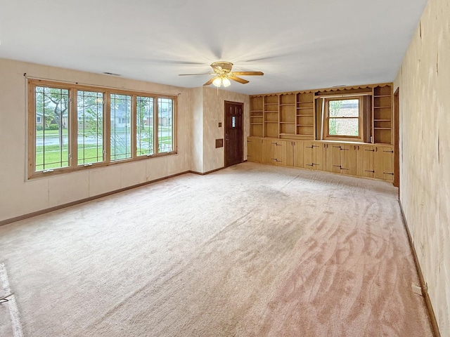 942 W Villa Dr, Des Plaines, IL 60016 - unfurnished room with ceiling fan, light colored carpet, and built in features