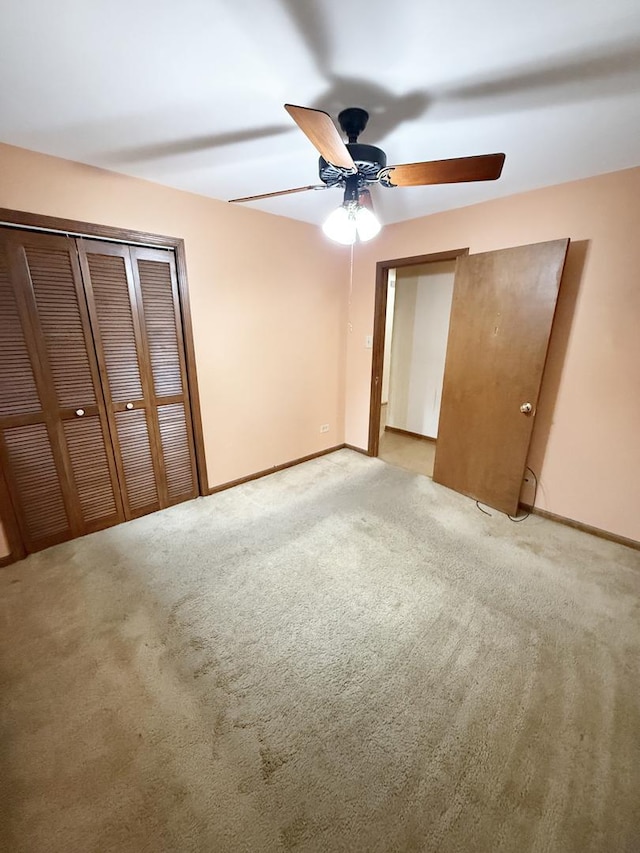 942 W Villa Dr, Des Plaines, IL 60016 - unfurnished bedroom with light colored carpet, baseboards, a closet, and a ceiling fan