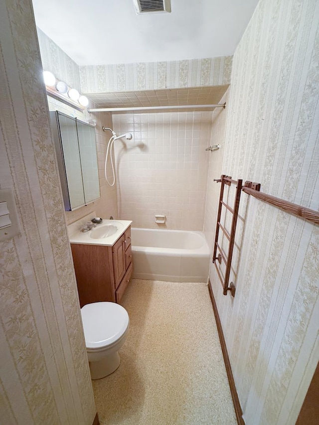 942 W Villa Dr, Des Plaines, IL 60016 - bathroom with wallpapered walls, toilet, vanity, and tub / shower combination