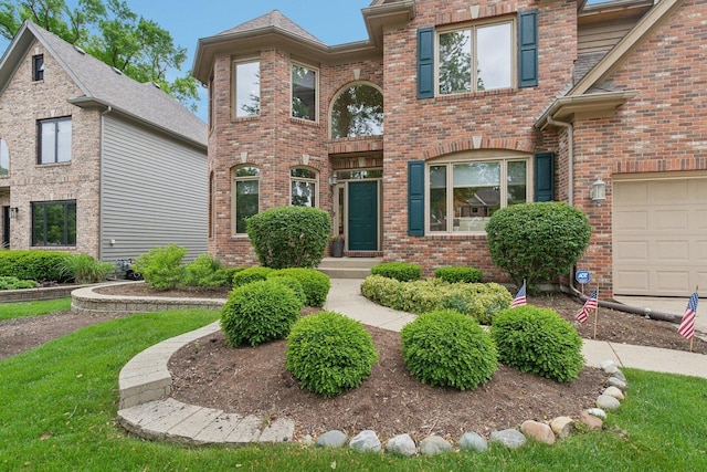 2156 Red Maple Ln, Aurora, IL 60502 - traditional-style home featuring brick siding and a garage