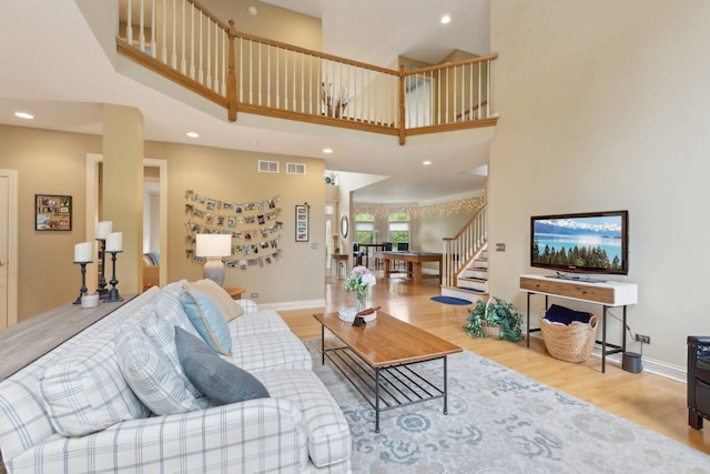 2156 Red Maple Ln, Aurora, IL 60502 - living room with a high ceiling, wood finished floors, stairway, recessed lighting, and baseboards