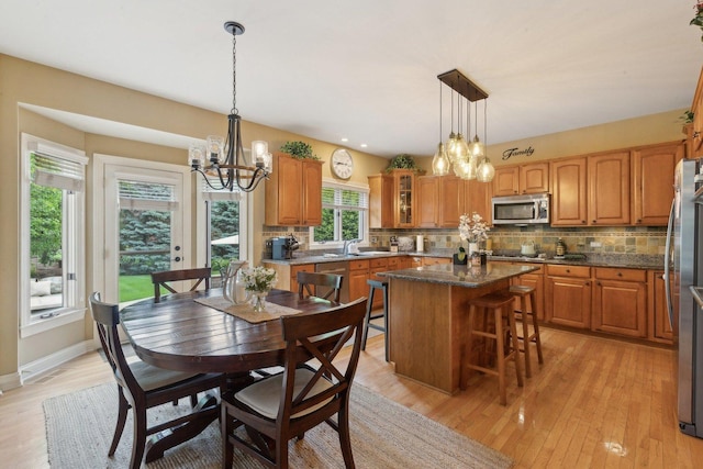 2156 Red Maple Ln, Aurora, IL 60502 - dining area with a chandelier, light wood-type flooring, baseboards, and recessed lighting