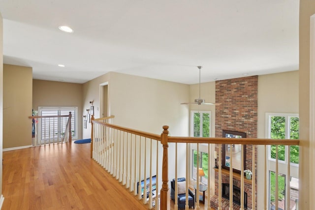 2156 Red Maple Ln, Aurora, IL 60502 - hallway with light wood-type flooring, baseboards, recessed lighting, and an upstairs landing