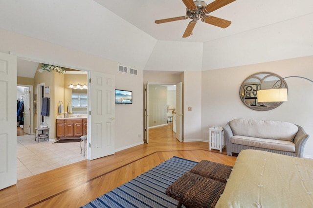 2156 Red Maple Ln, Aurora, IL 60502 - living room with baseboards, light wood finished floors, ceiling fan, and high vaulted ceiling