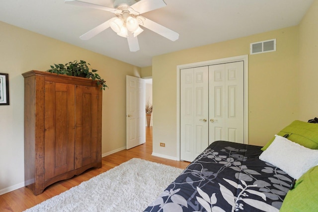 2156 Red Maple Ln, Aurora, IL 60502 - bedroom featuring wood finished floors, a closet, a ceiling fan, and baseboards