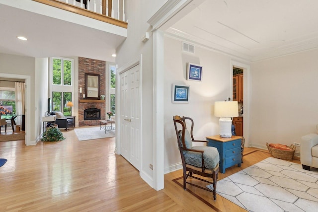 2156 Red Maple Ln, Aurora, IL 60502 - sitting room featuring healthy amount of natural light, light wood-style floors, a fireplace, and recessed lighting