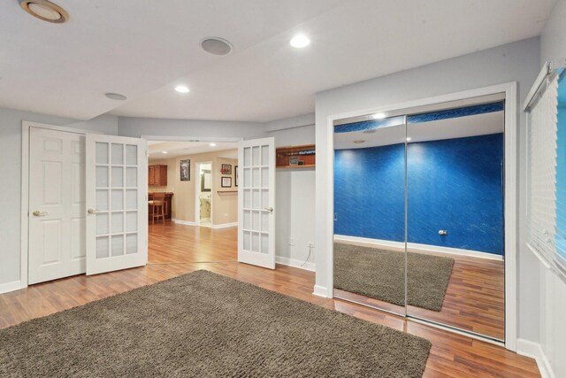 2156 Red Maple Ln, Aurora, IL 60502 - unfurnished bedroom with french doors, wood finished floors, baseboards, and recessed lighting