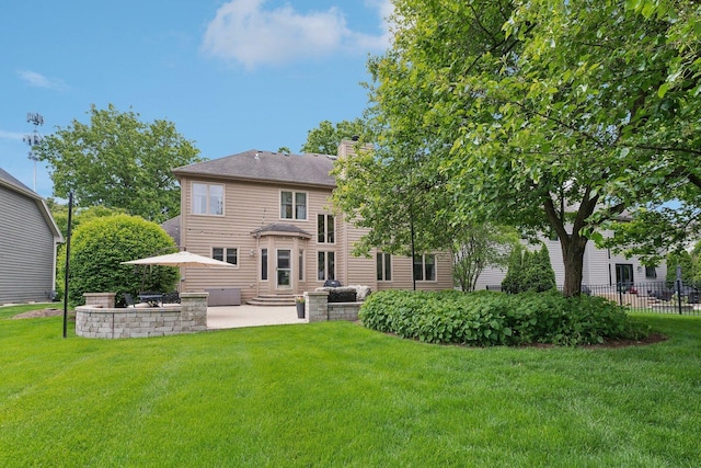 2156 Red Maple Ln, Aurora, IL 60502 - back of house featuring a patio area, entry steps, and a chimney