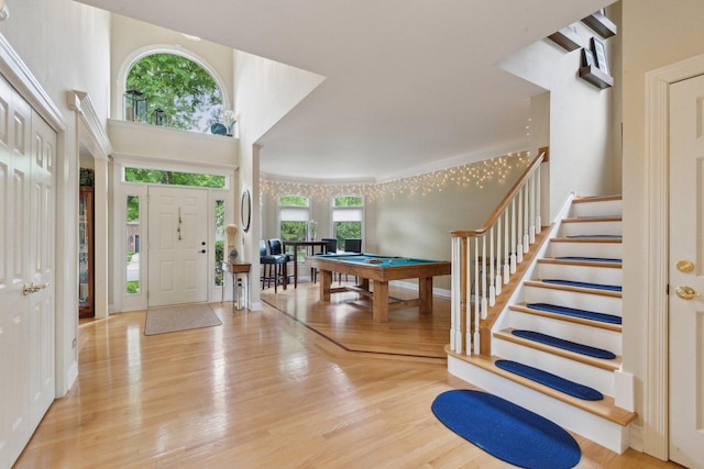 2156 Red Maple Ln, Aurora, IL 60502 - foyer featuring billiards, wood finished floors, and stairs