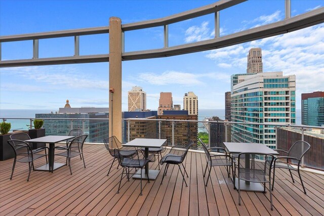 600 N Fairbanks Ct Unit 3306, Chicago, IL 60611 - wooden deck with outdoor dining area, a city view, and a water view