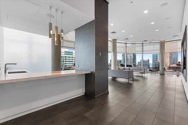 600 N Fairbanks Ct Unit 3306, Chicago, IL 60611 - welcome area featuring a sink, a wall of windows, a city view, and recessed lighting