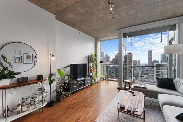 600 N Fairbanks Ct Unit 3306, Chicago, IL 60611 - living area featuring a desk, wood finished floors, and a wall of windows