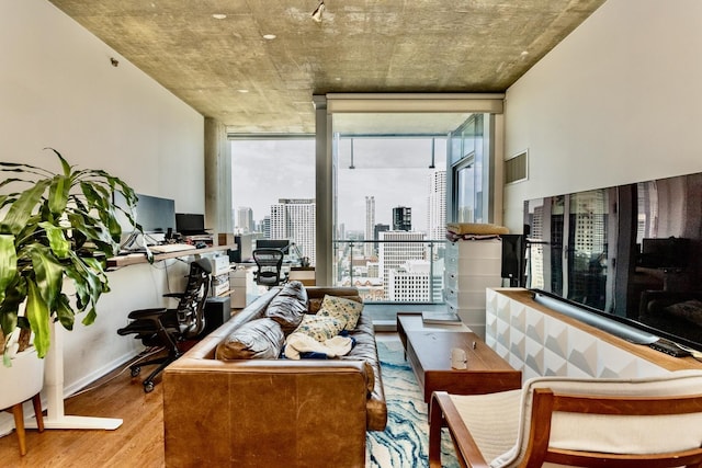 600 N Fairbanks Ct Unit 3306, Chicago, IL 60611 - living area featuring wood finished floors, healthy amount of natural light, a desk, floor to ceiling windows, and baseboards