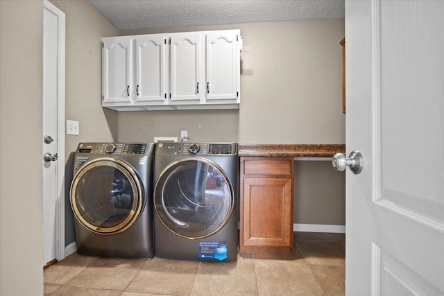 3100 Shepard Rd, Normal, IL 61761 - washroom with cabinet space, washer and clothes dryer, a textured ceiling, and baseboards