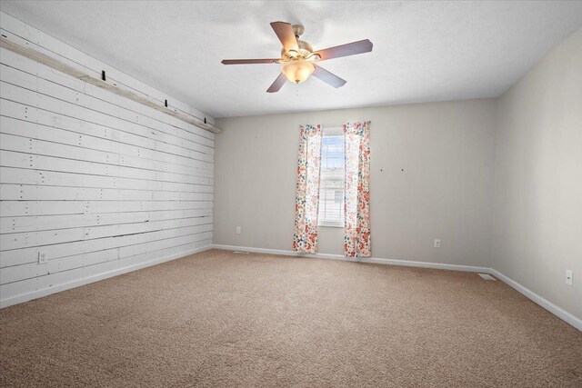 3100 Shepard Rd, Normal, IL 61761 - carpeted spare room featuring baseboards, ceiling fan, and a textured ceiling