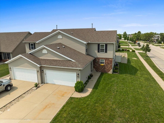 3100 Shepard Rd, Normal, IL 61761 - view of front of property with concrete driveway, an attached garage, a front lawn, a shingled roof, and brick siding