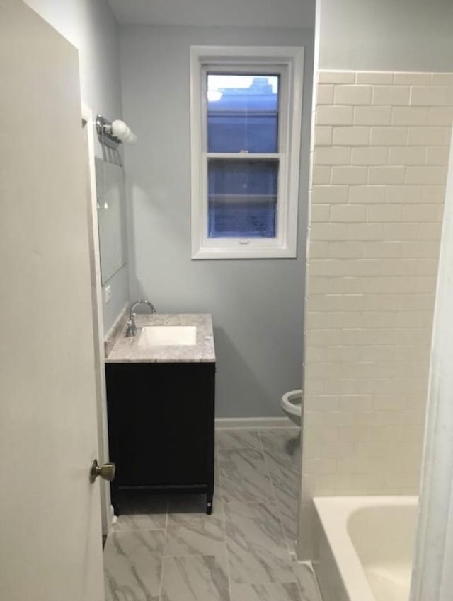6838 S Clyde Ave, Chicago, IL 60649 - bathroom with marble look tiles, vanity, and toilet