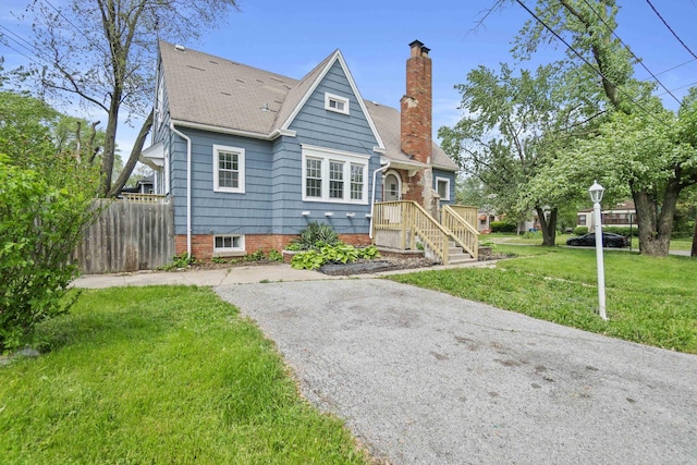 14856 Perry Ave, South Holland, IL 60473 - bungalow featuring a chimney and roof with shingles