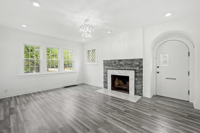 14856 Perry Ave, South Holland, IL 60473 - unfurnished living room featuring a premium fireplace, wood finished floors, recessed lighting, a chandelier, and baseboards