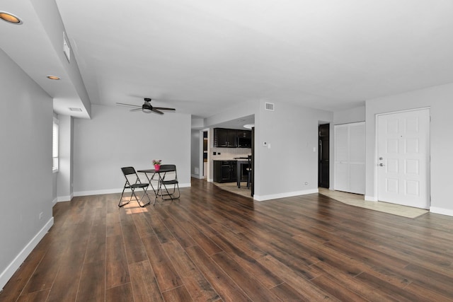 4739 W 105th St Unit 101, Oak Lawn, IL 60453 - unfurnished living room featuring a ceiling fan, dark wood finished floors, and baseboards