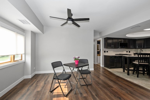 4739 W 105th St Unit 101, Oak Lawn, IL 60453 - dining space with dark wood finished floors, ceiling fan, and baseboards