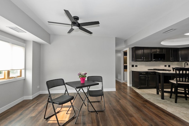 4739 W 105th St Unit 101, Oak Lawn, IL 60453 - dining room with wood finished floors, a ceiling fan, and baseboards