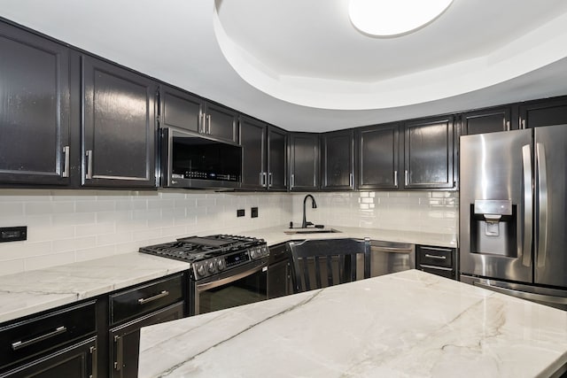 4739 W 105th St Unit 101, Oak Lawn, IL 60453 - kitchen featuring appliances with stainless steel finishes, a sink, dark cabinetry, and decorative backsplash