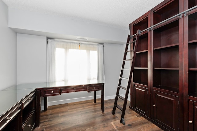 4739 W 105th St Unit 101, Oak Lawn, IL 60453 - unfurnished office with dark wood-style floors, a textured ceiling, and baseboards