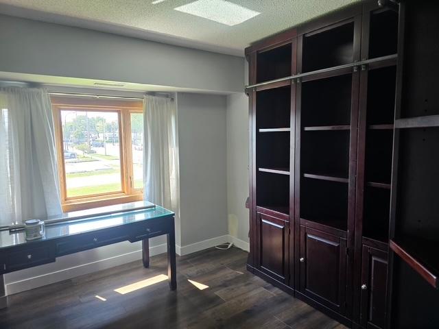 4739 W 105th Pl Unit 101, Oak Lawn, IL 60453 - unfurnished office with dark wood finished floors and baseboards