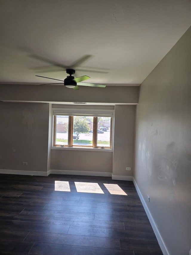 4739 W 105th Pl Unit 101, Oak Lawn, IL 60453 - unfurnished room featuring a ceiling fan, baseboards, and dark wood-style flooring