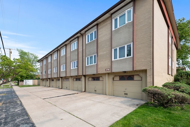 4739 W 105th St Unit 101, Oak Lawn, IL 60453 - view of building exterior featuring driveway