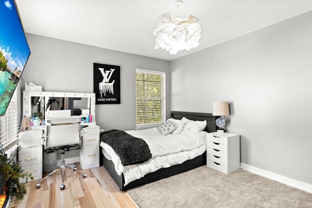 714 Shepard Ct, Gurnee, IL 60031 - bedroom with a chandelier, baseboards, a desk, and light wood-type flooring