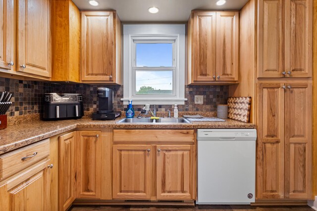 207 N E Ave, Ogden, IL 61859 - kitchen featuring dishwasher, a sink, and backsplash
