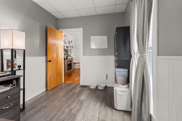 207 N E Ave, Ogden, IL 61859 - bathroom with a wainscoted wall, wood finished floors, and a drop ceiling