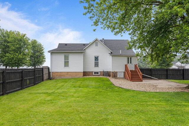 207 N E Ave, Ogden, IL 61859 - back of house featuring a shingled roof and central air condition unit